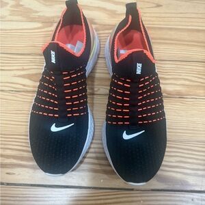 Nike Woman’s Black and Orange Flyknit Sneakers